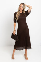 Airlie crochet midi dress in chocolate brown, open-weave knit midi dress with short sleeves, styled with a brown clutch and thong sandals