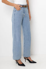 Light blue jeans worn by a person on a white background