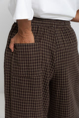 Landon wide leg check pants in chocolate brown, drawstring waist trousers with plaid pattern, styled with a white tee and mesh flats