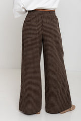 Landon wide leg check pants in chocolate brown, drawstring waist trousers with plaid pattern, styled with a white tee and mesh flats