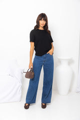River wide-leg denim jeans in mid blue, high-waisted straight-leg jeans styled with a black t-shirt and woven leather flats