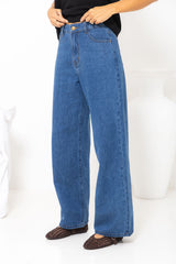 River wide-leg denim jeans in mid blue, high-waisted straight-leg jeans styled with a black t-shirt and woven leather flats