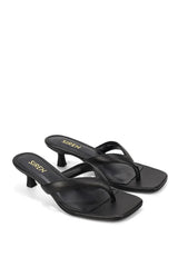 A pair of black leather Siren brand mid-heel thong sandals with square toes and gold branding on the insole, set against a plain white background.