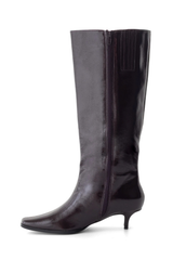 A dark purple knee-high leather boot with a pointed toe, kitten heel, and side zipper, shown against a plain white background.