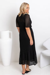 Airlie crochet dress in black, open-weave knit dress with short sleeves, styled with a black leather bucket bag and printed slide sandals