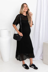Airlie crochet dress in black, open-weave knit dress with short sleeves, styled with a black crossbody bag and black sneakers
