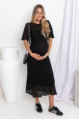 Airlie crochet dress in black, open-weave knit dress with short sleeves, styled with a black crossbody bag and black sneakers