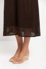 Airlie crochet midi dress in chocolate brown, open-weave knit midi dress with short sleeves, styled with a tan tote bag and thong sandals