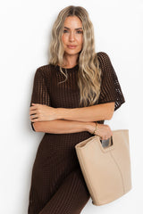 Airlie crochet midi dress in chocolate brown, open-weave knit midi dress with short sleeves, styled with a tan tote bag and thong sandals