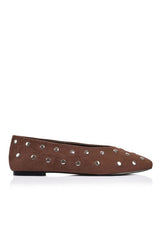 A single brown suede flat shoe decorated with silver metal studs, shown in profile against a white background.