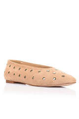 A single beige suede flat shoe with pointed toe and silver metal studs, shown from a side profile on a white background.