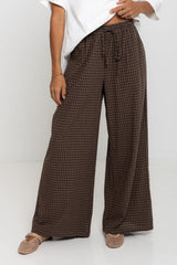 Landon wide leg check pants in chocolate brown, drawstring waist trousers with plaid pattern, styled with a white tee and mesh flats