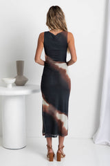 A model wearing a sleeveless, fitted mesh midi dress with a watercolour print, featuring a side split and ruched detail.