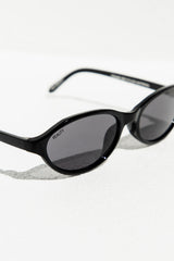 Black sunglasses with gray lenses on a white background