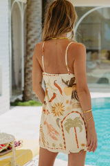 Woman wearing a patterned dress by a poolside